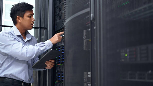 istock System administrator working with digital tablet to check server and equipment  in data center. 2151569177