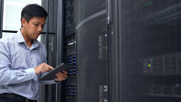istock System administrator working with digital tablet to check server and equipment  in data center. 2151569594