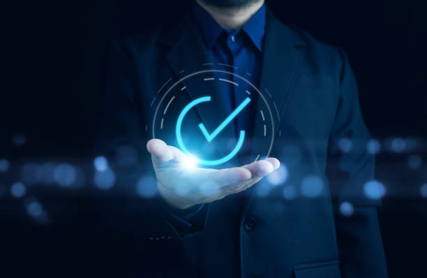 istock Businessman hand showing check mark digital technology icon symbol. Top quality assurance service concept, product performance assurance, and industry-leading ISO certification. 2151569726