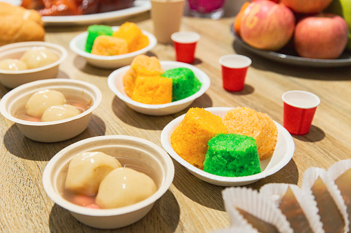 Array of Colorful Banh Troi and Steam Rice Cakes Inviting a Celebration of Vietnamese Culinary Traditions