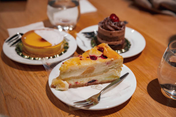 istock Delectable Dessert Spread: Lemon Tart, Cheesecake, and Chocolate Mousse Cake 2151571220
