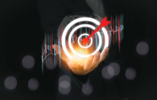 istock Business holding red arrow dart to virtual target dart board. Setup objectives and target for business investment concept, Digital marketing, Business goal and technology concept. 2151572492