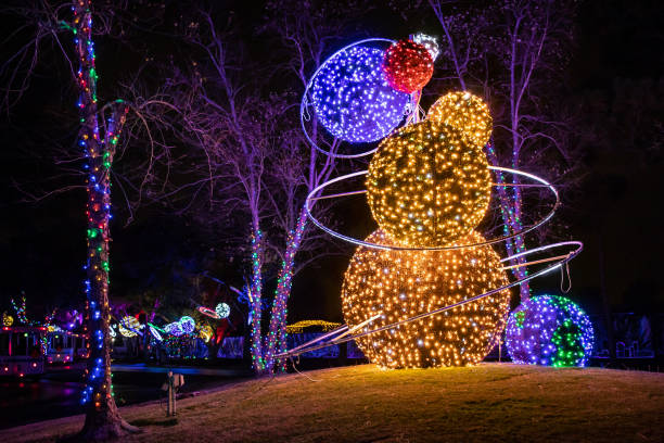 Orange and purple galaxy themed Christmas light display. P