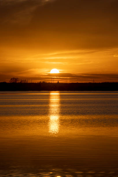 istock The sky and the lake are red-tinged during sunset 2151579477
