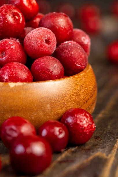 istock frozen to store red cherry berries in frost 2151579515