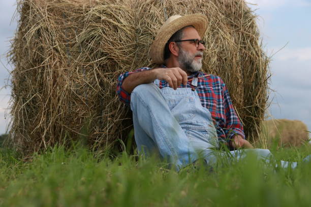 istock Mature farmer relax on green field 2151579960
