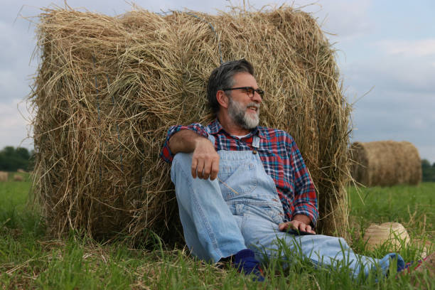 istock Mature farmer relax on green field 2151579995