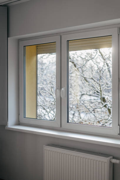 istock Metal-plastic frame for a pvc window over central heating radiator 2151580460
