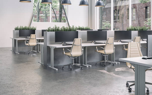 istock Modern office interior with work desks and large windows  on cement floor in the morning sun 2151581388
