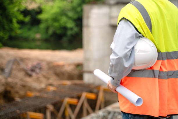 istock Engineer supervising the construction of a new road 2151582226