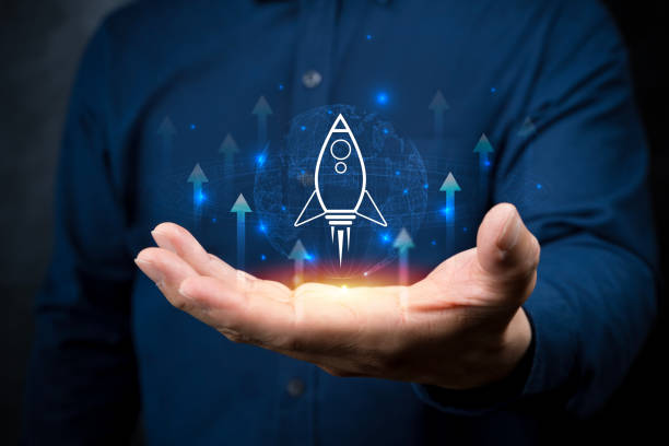 istock Startup business concept, Businessman holding globe with rocket icon. 2151585915