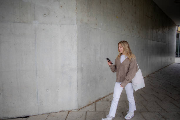 istock Young blonde woman walking 2151586656