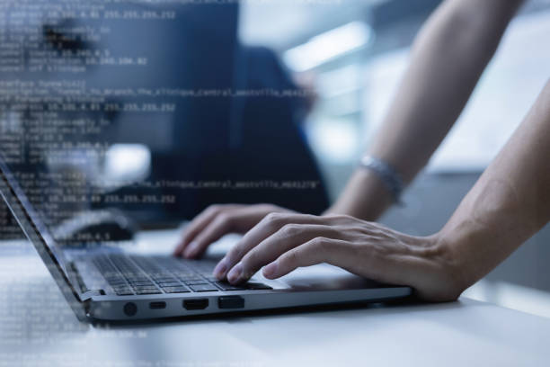 istock close up specialist programmer man hand type configuration on keyboard at laptop for check software for fix bug and defect of system in data center room , engineering and technology 2151590072
