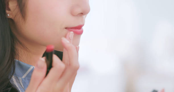 istock asian businss woman doing makeup 2151590706