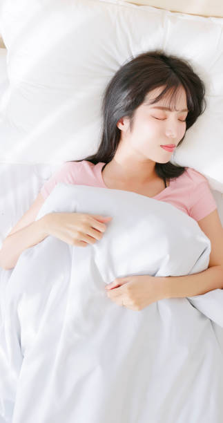 istock Asian woman has good sleep 2151590747