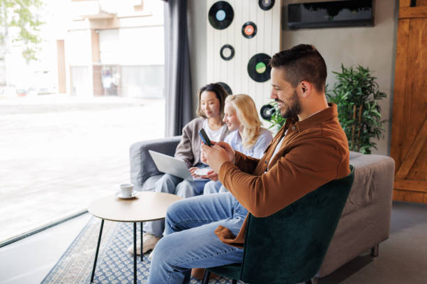 istock Group of young people working in cafeteria 2151591421
