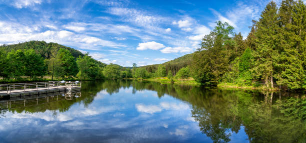 View at a lake in the Spiesswoogtal valley near the German village Fischbach bei Dahn in the Rhineland-Palatinate
