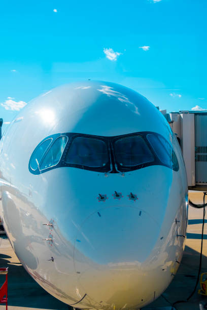 istock Front view of generic commercial aircraft cockpit nose 2151592816