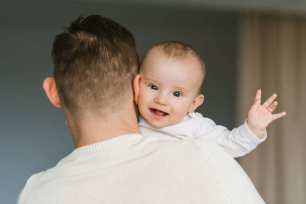 istock Happy smiling baby in Dad's arms 2151593894