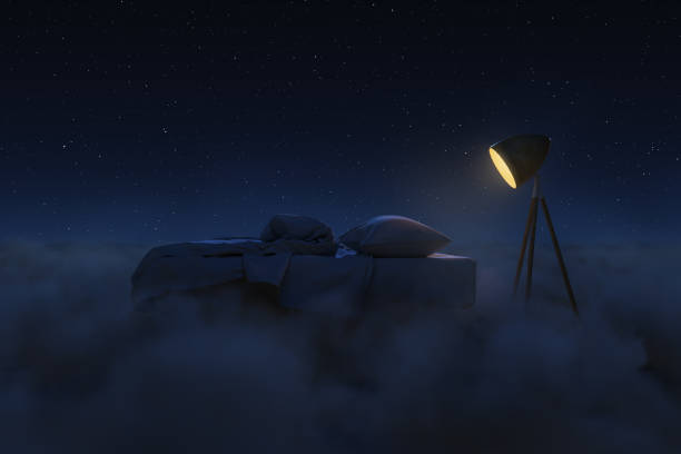 istock Cosy bed illuminated by lamp. The bed flying over fluffy clouds at night. 3D Rendering 2151605150