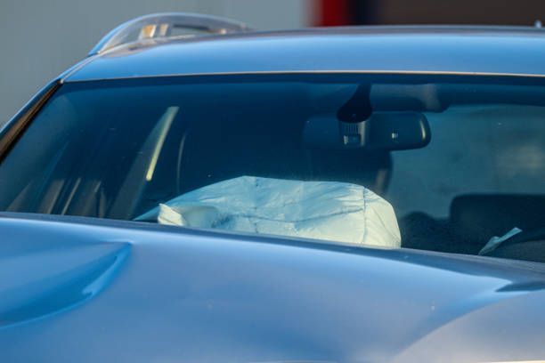 istock Hood of a crash damaged silver car with airbag deployed.. 2151606702
