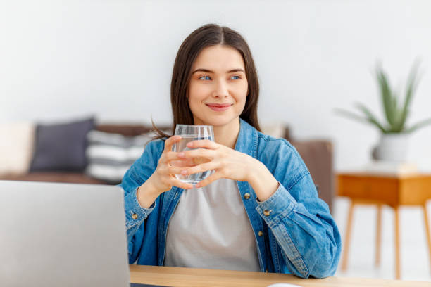istock Remote work Female freelancer working sitting at the table at home 2151609168