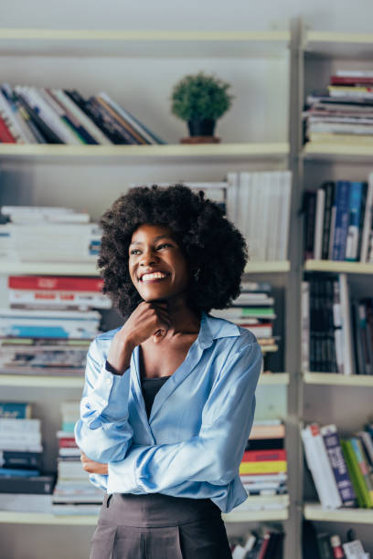 istock Confident Businesswoman in a Library Smiling 2151609612