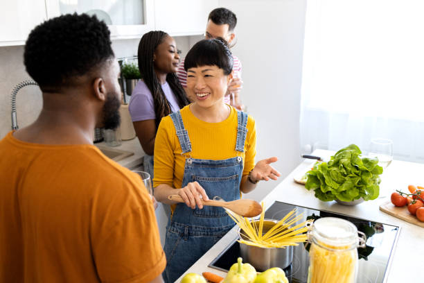 istock Group of friends Cooking Together in kitchen 2151612015