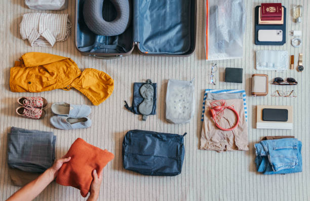 istock An Anonymous Woman Packing A Suitcase At Home 2151612483
