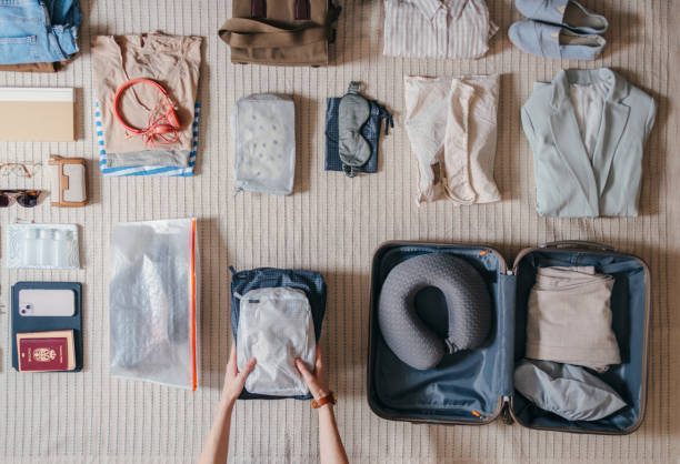 istock Unrecognizable Woman Packing A Suitcase At Home 2151612490