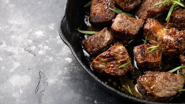 istock Garlic butter beef steak bites in iron cast pan 2151614416