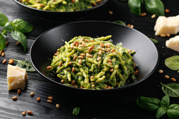 istock Trofie pasta with creamy spinach sauce and toasted pine nuts 2151614476