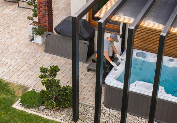 Garden SPA Technician Finishing Hot Tub Installation