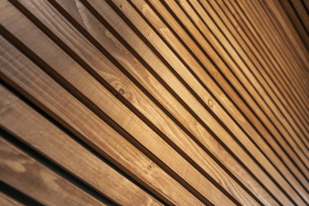Wooden Lamellas Decorative Wall Close Up. Modern Architectural Materials