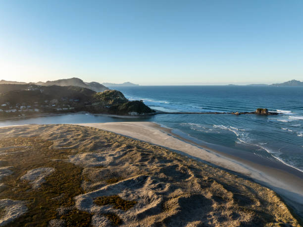 An aerial view of the dunes, estuary and ocean beach of Mangawhai Heads, one of the popular seaside resorts north east of Auckland.