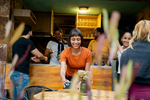 istock People sharing food and drinks in a restaurant 2151620789