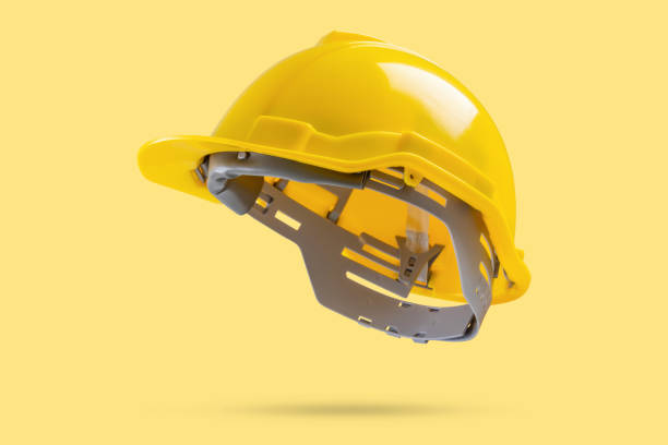 istock Safety construction helmet on yellow background 2151624822