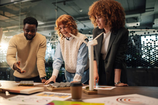 istock Diverse ecologists collaborating on renewable energy project at office 2151625380
