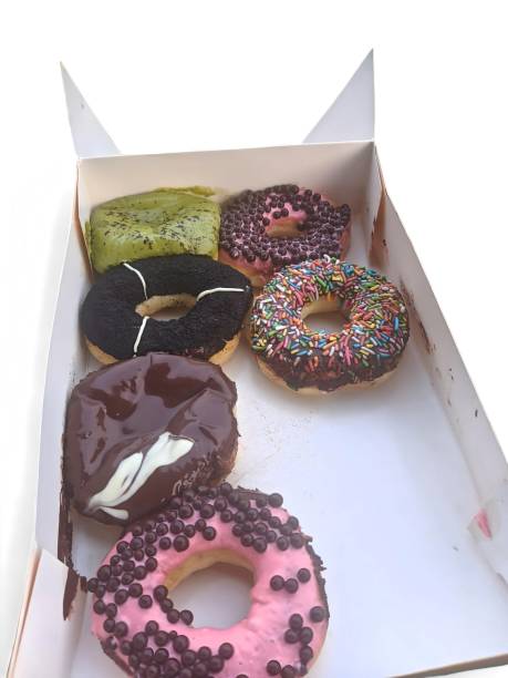 istock Portrait of various donuts in a box on a white background 2151625467