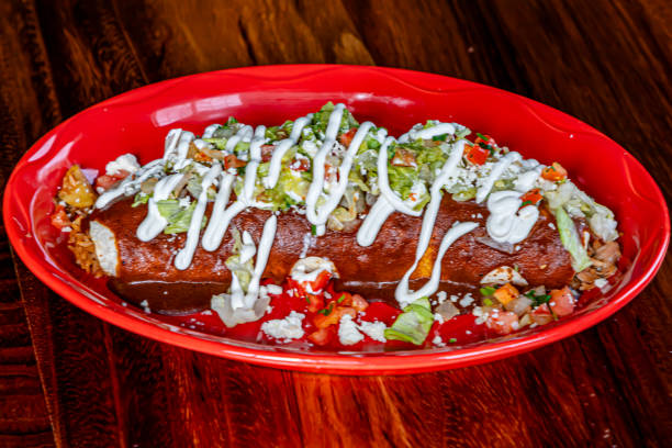 Partially eaten gourmet enchilada.