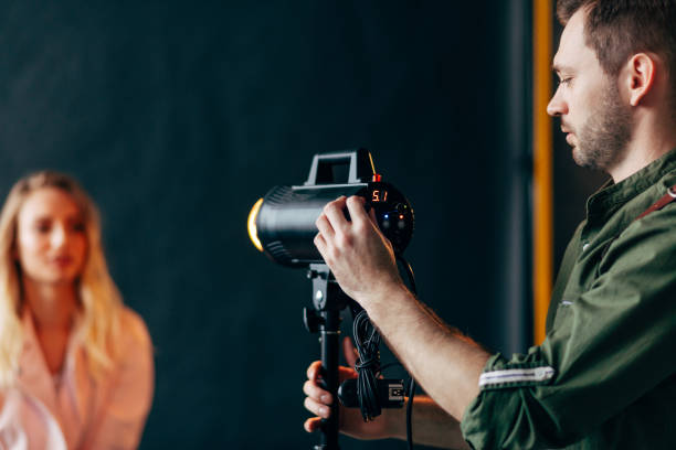 istock attractive man using the equipment for photo and video studio 2151629883