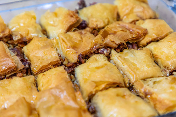 Greek Baklava, Sweet Pastry styled with a  fork on a blue plate from a cafe in Darwin. Taken on a Pro Nikon D300