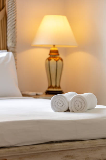 Close up of towel on bed. Cozy room interior. Concept of domestic living.