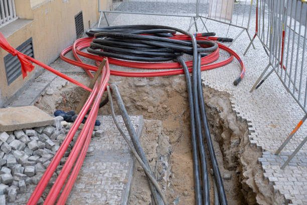 istock Construction site with electric cables are buried underground, infrastructure installation, lot of communication Cables on street 2151637014