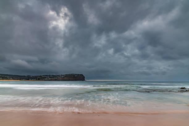 istock Rainy day sunrise at the beach 2151638084