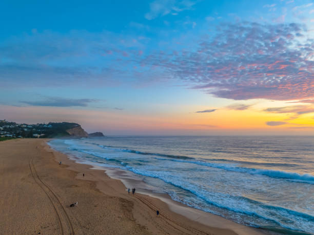 istock Hazy Summer Sunrise at the seaside with high cloud 2151638133