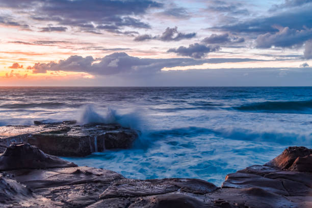 istock Sunrise, sea, waves, clouds and tessellated rock platform 2151638167