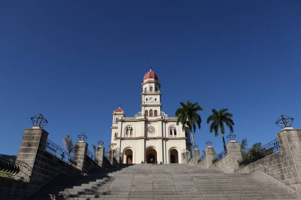 Looking up the steps that lead to El Caridad de Cobre church, which is very important in Cuba due to the fact it is a national shrine and houses the icon of \
