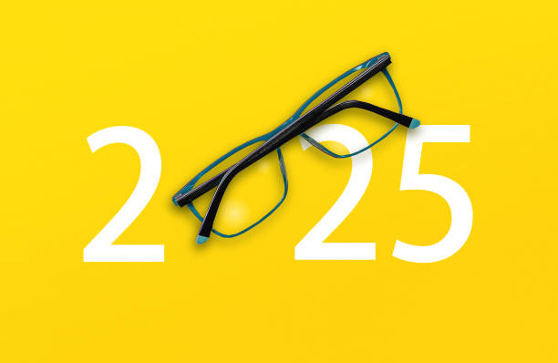 istock 2025 with glasses on yellow isolated background 2151641886