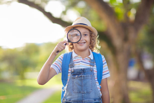 istock Kids explore nature. Children hike in sunny park. 2151646905